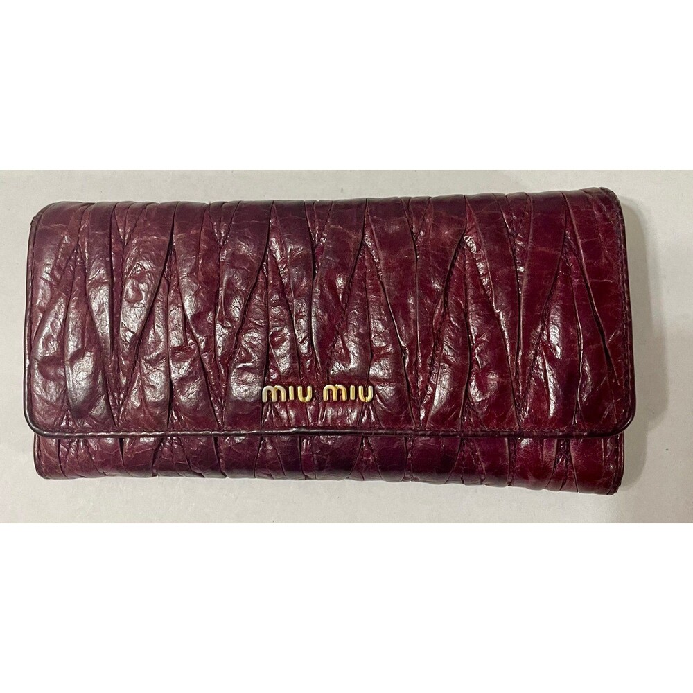 Well loved Miu Miu long dark purple, wallet, leather